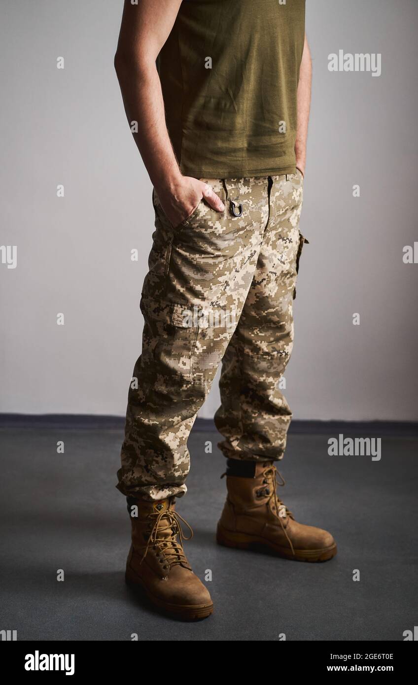 Lowsection portrait of a military man wearing a uniform and boots Stock Photo Alamy
