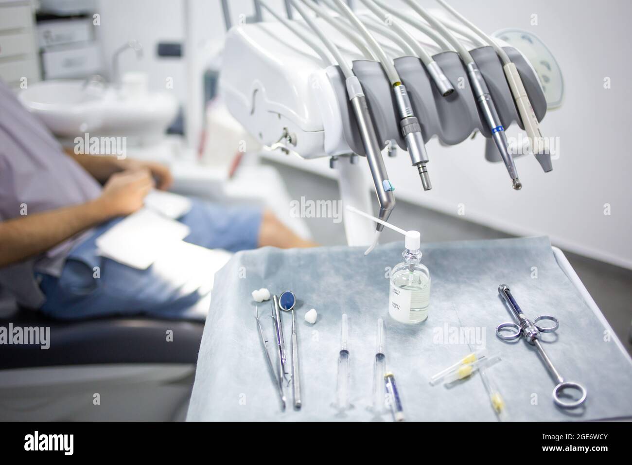 Medical tray table with dental tools, medicines and equipment, patient
