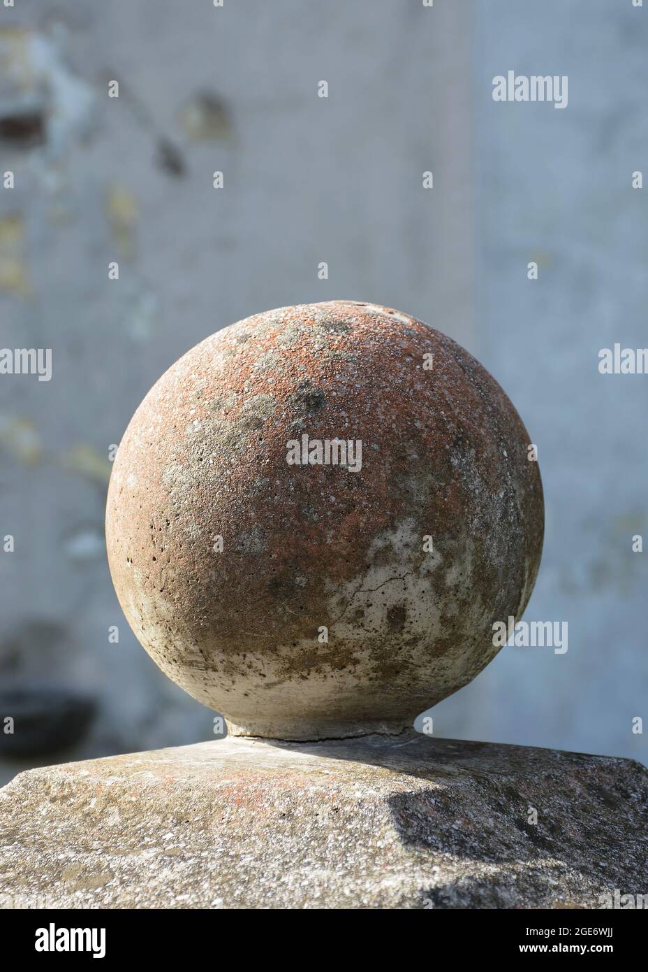 Stone ball finial on pedestal. Traditional post topper or post cap Stock Photo
