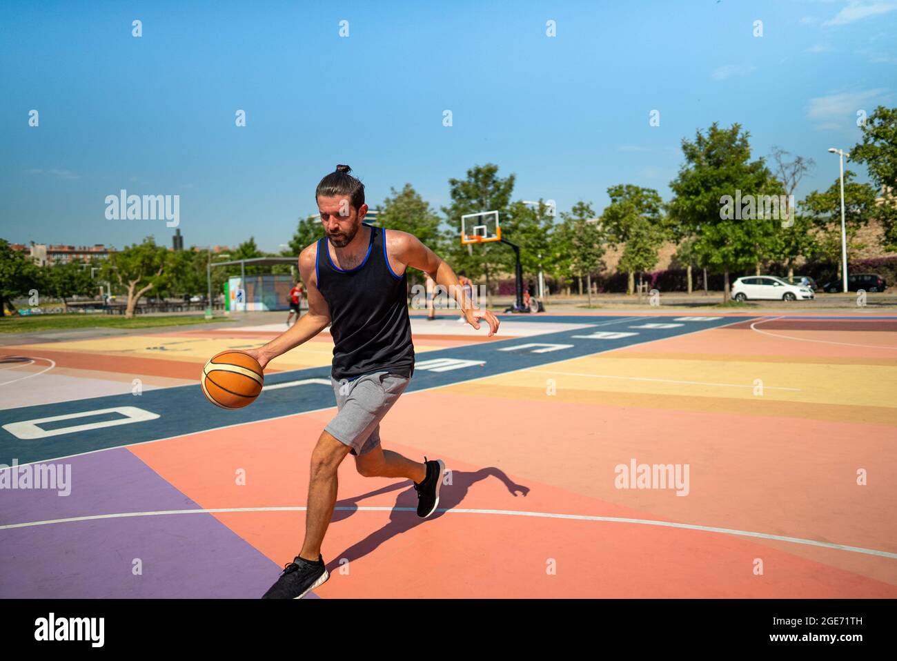 basketball player runs on a basketball court with a ball. Motivation