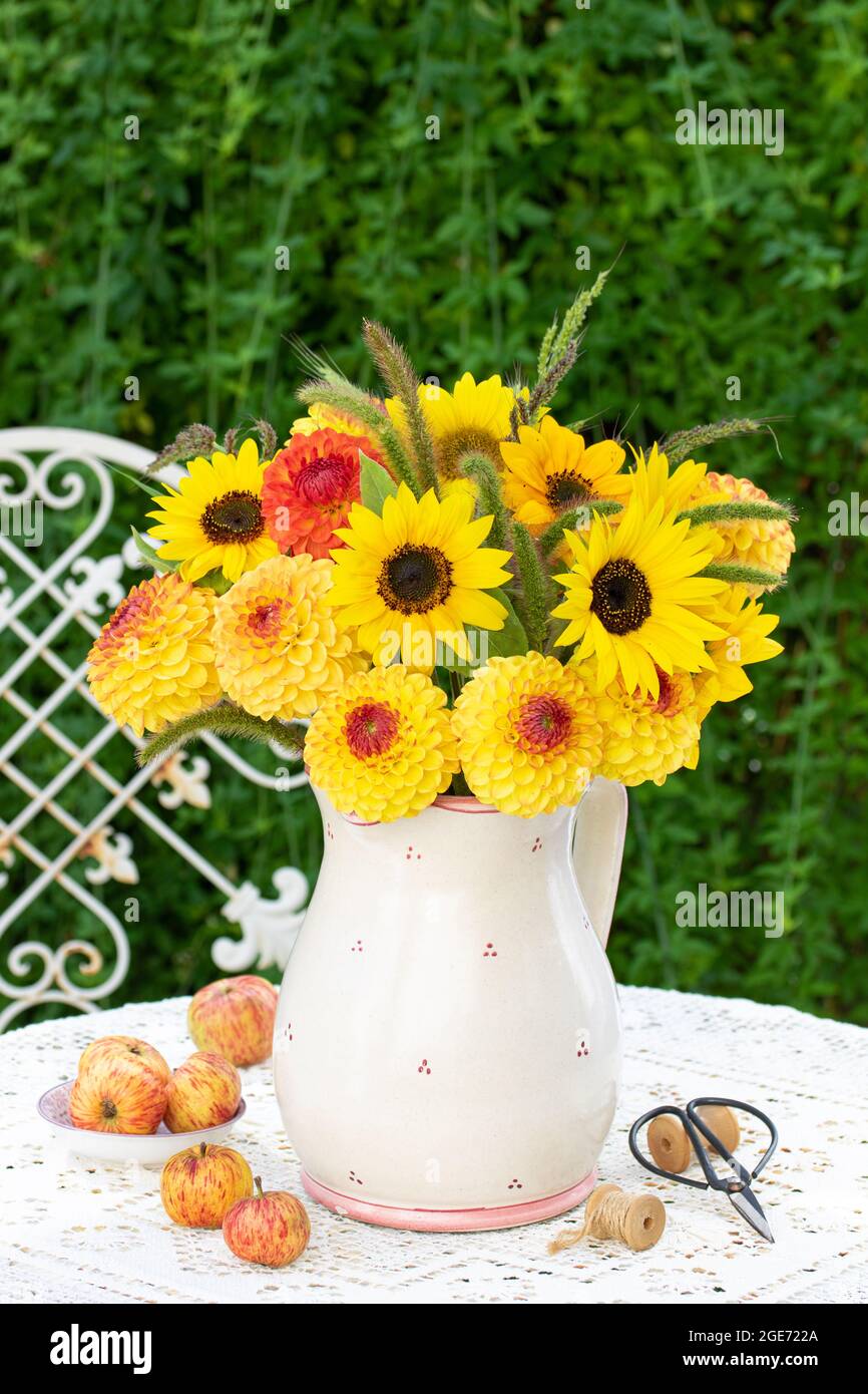 bouquet of sunflowers and dahlias in rustic vase Stock Photo - Alamy