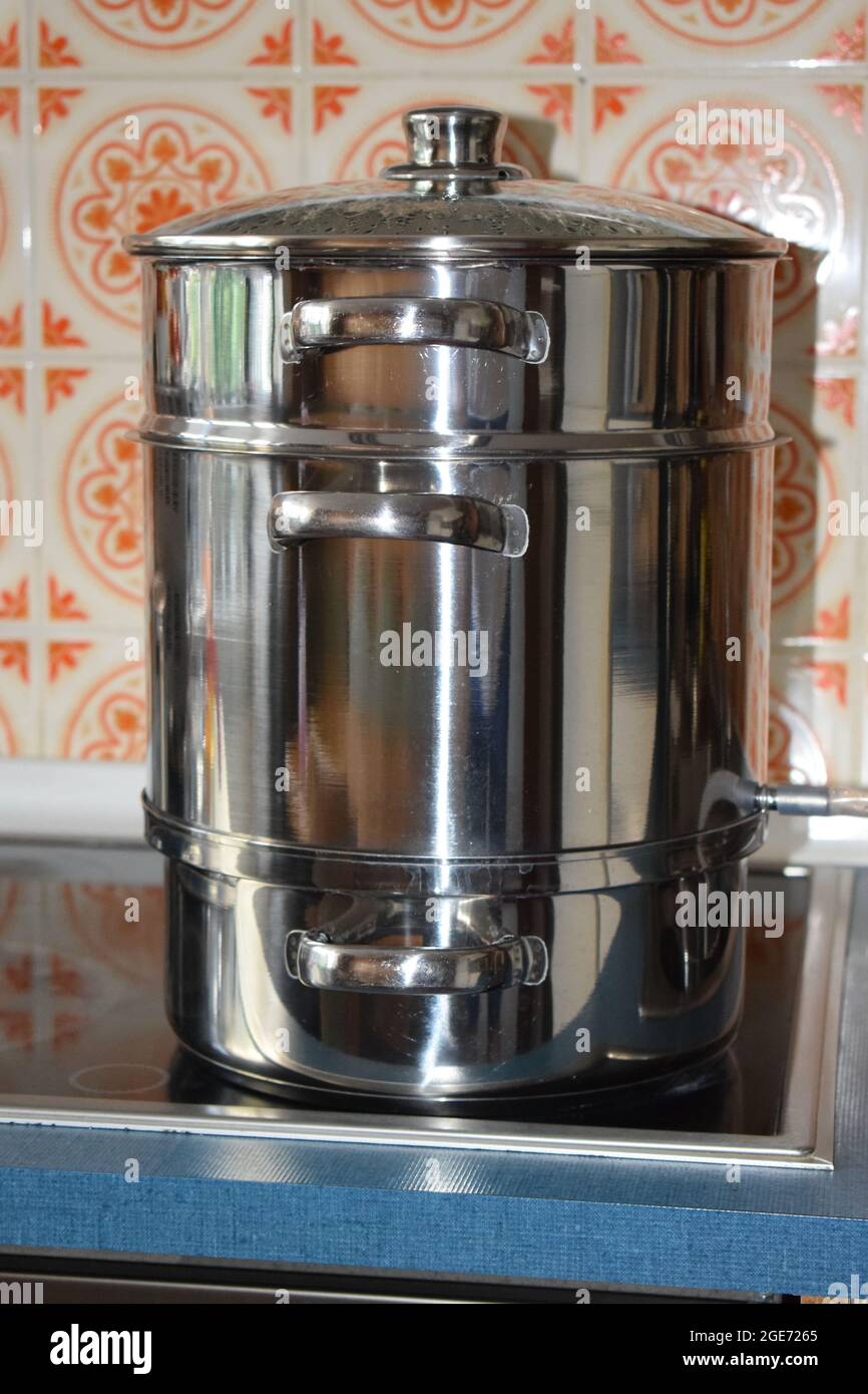 old fashioned stainless steel steam juicer Stock Photo