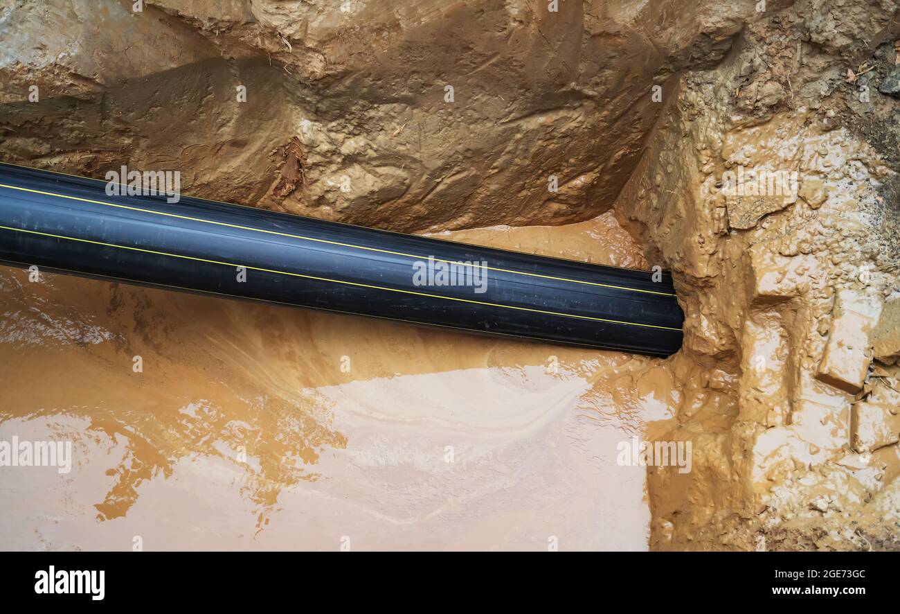 Repair of the underground pipeline. Laying a plastic pipe underground