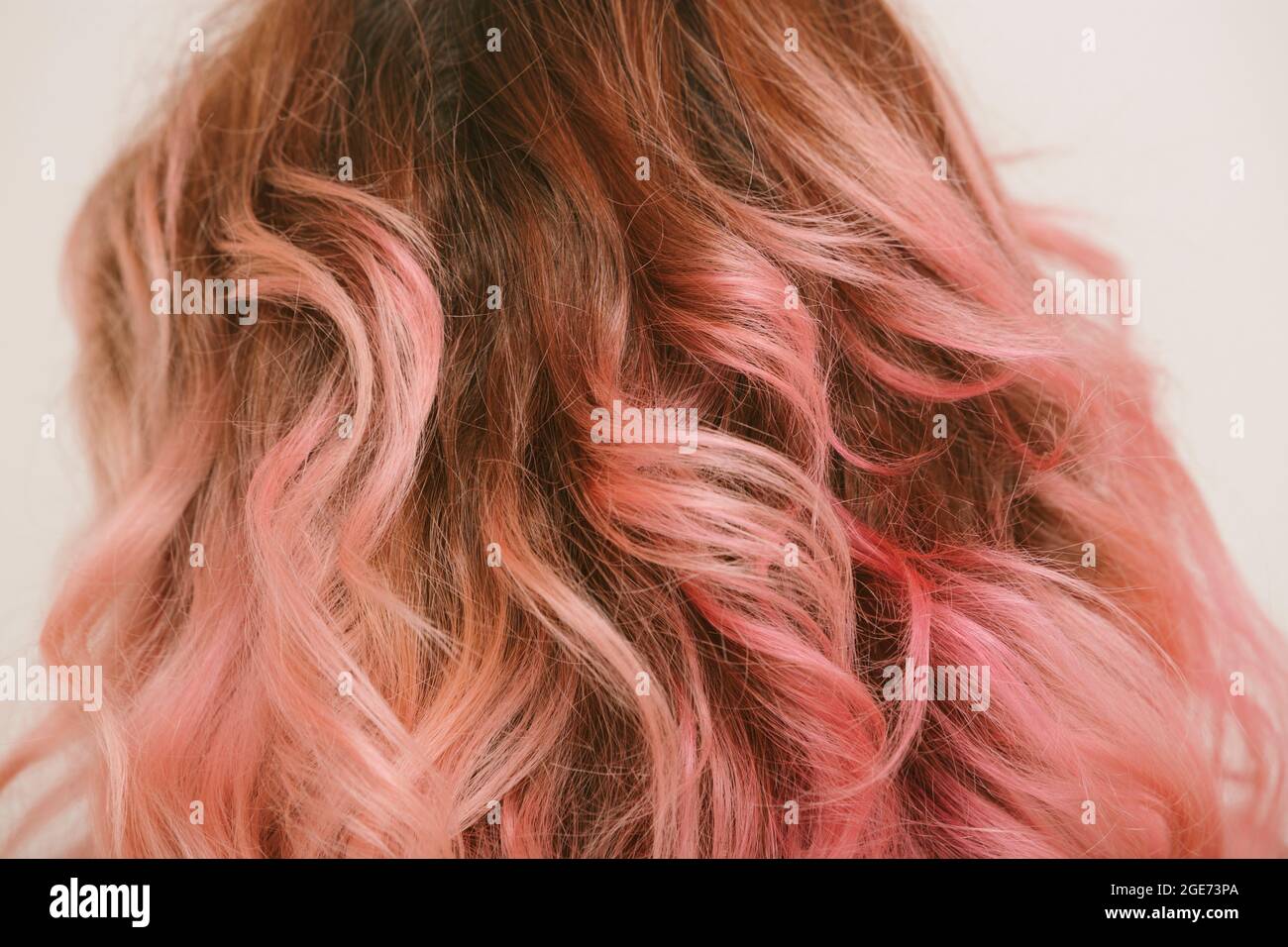 pink painted wavy hair detail Stock Photo