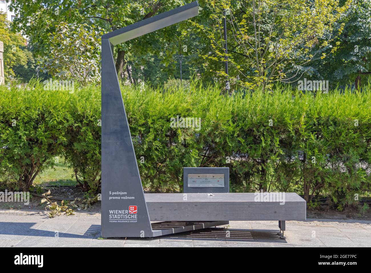Belgrade, Serbia - August 08, 2021: Smart Bench WiFi and Solar Charging in City Park at Sunny Summer Day. Stock Photo