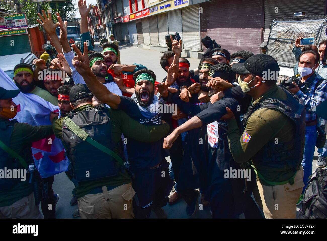 A Kashmiri Shiite mourner shouts religious slogans, as he defies ...