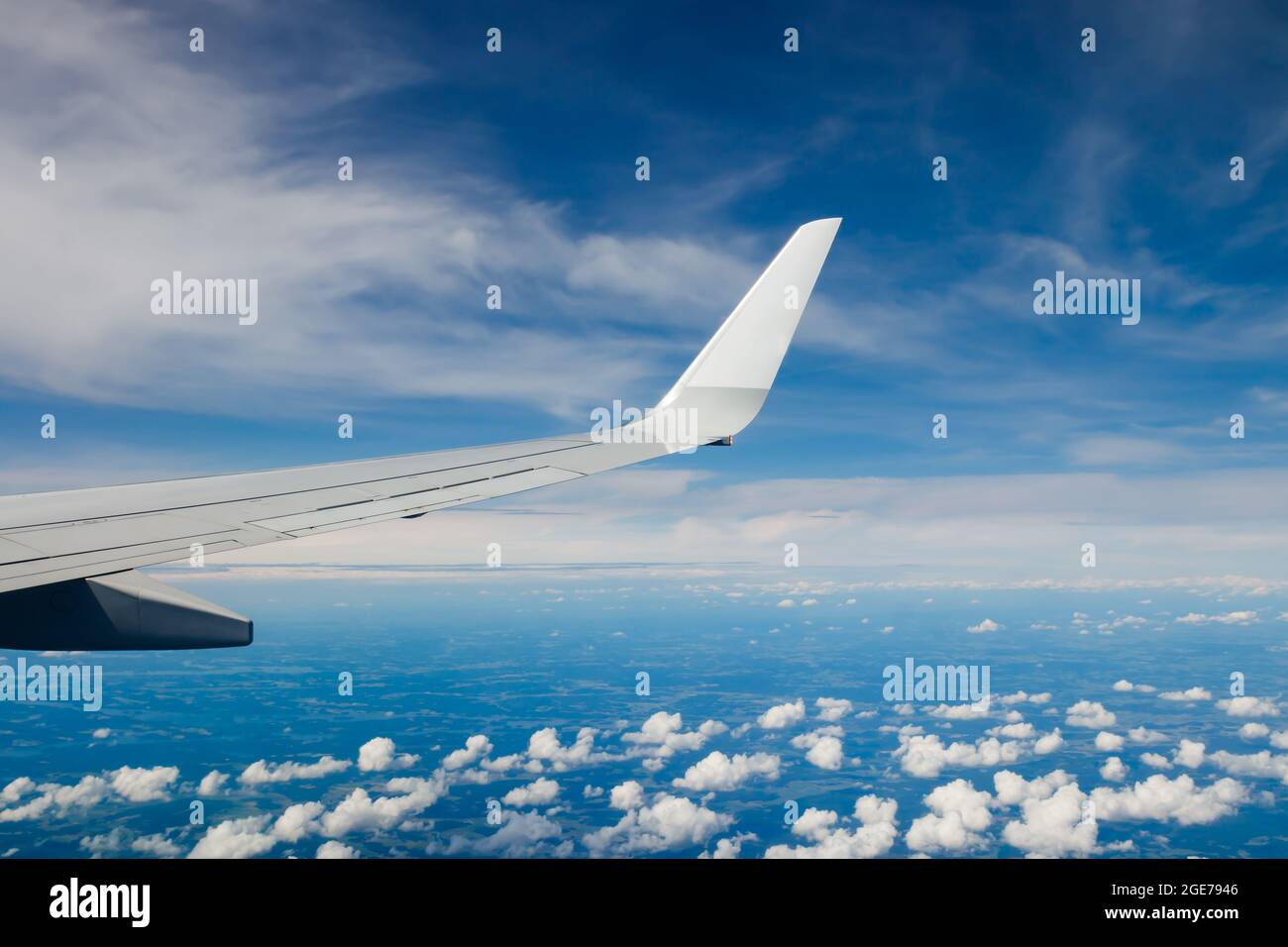 Plain wing over blue sky flight from helsinki to amsterdam stock photo