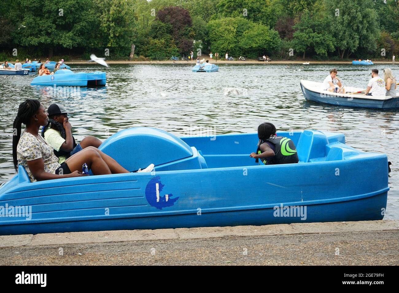Visitors pedal boating on the Serpentine Lake in London Hyde Park