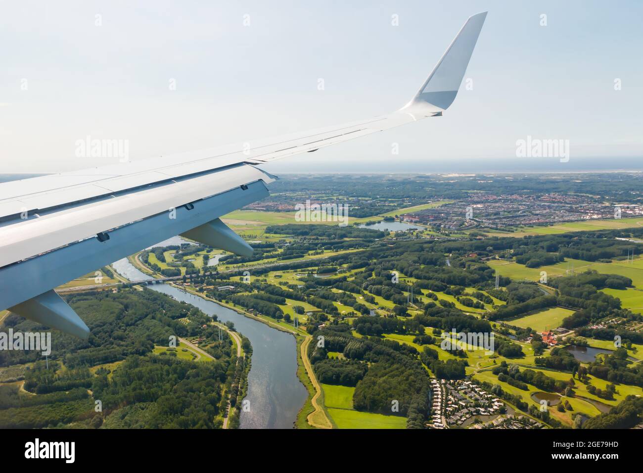 Plain wing over holland flight from helsinki to amsterdam stock photo