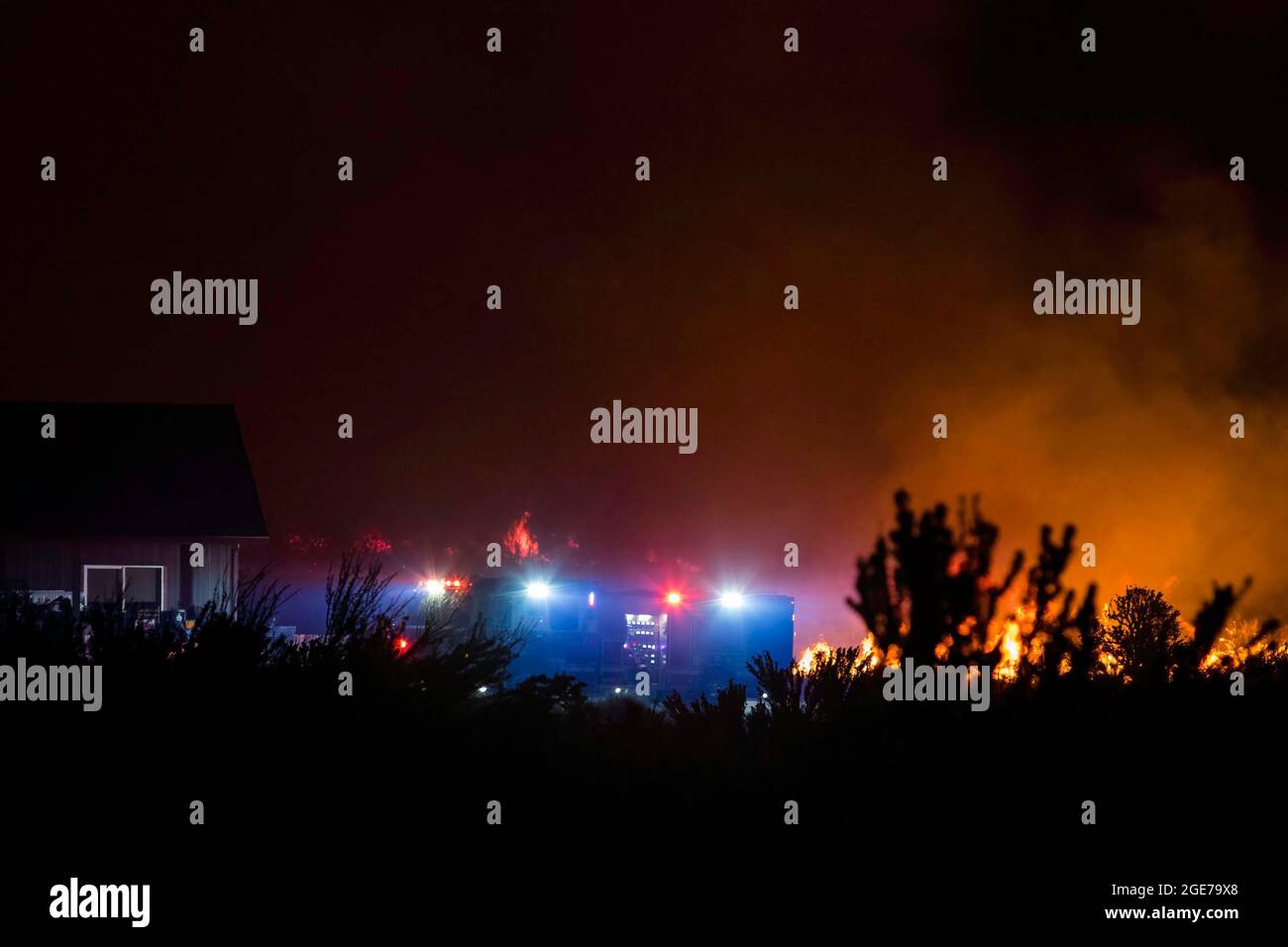 United States. 16th Aug, 2021. Firefighter trucks work to protect homes from the Dixie fire. The Dixie Fire has reached highway 395, as of today, Cal Fire reports that the Dixie Fire has now grown to a total of 604,511 acres (around 944 square miles). It remains 31 percent contained. The cause of the fire is still being investigated. (Photo by Ty O'Neil/SOPA Images/Sipa USA) Credit: Sipa USA/Alamy Live News Stock Photo