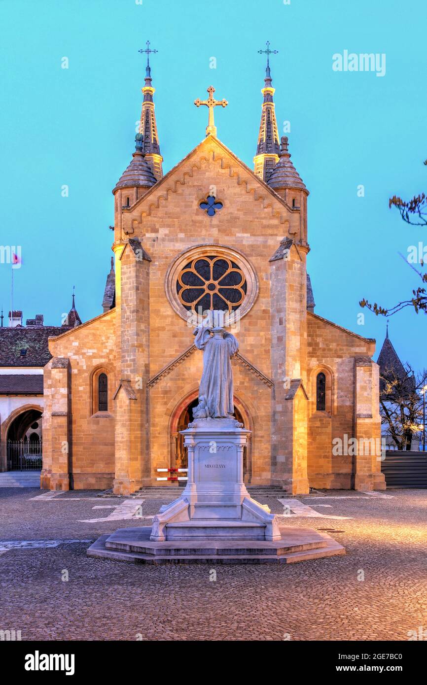 Night capture of The Collégiale church, consecrated in 1276 and a fine example of early Gothic architecture in Neuchatel, Switzerland Stock Photo