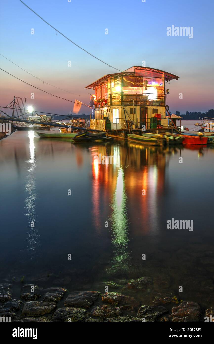 Gorgeous sunset with one of the floating restaurants on the Danube in Zemun, nowdays part of Belgrade the capital of Serbia. Stock Photo