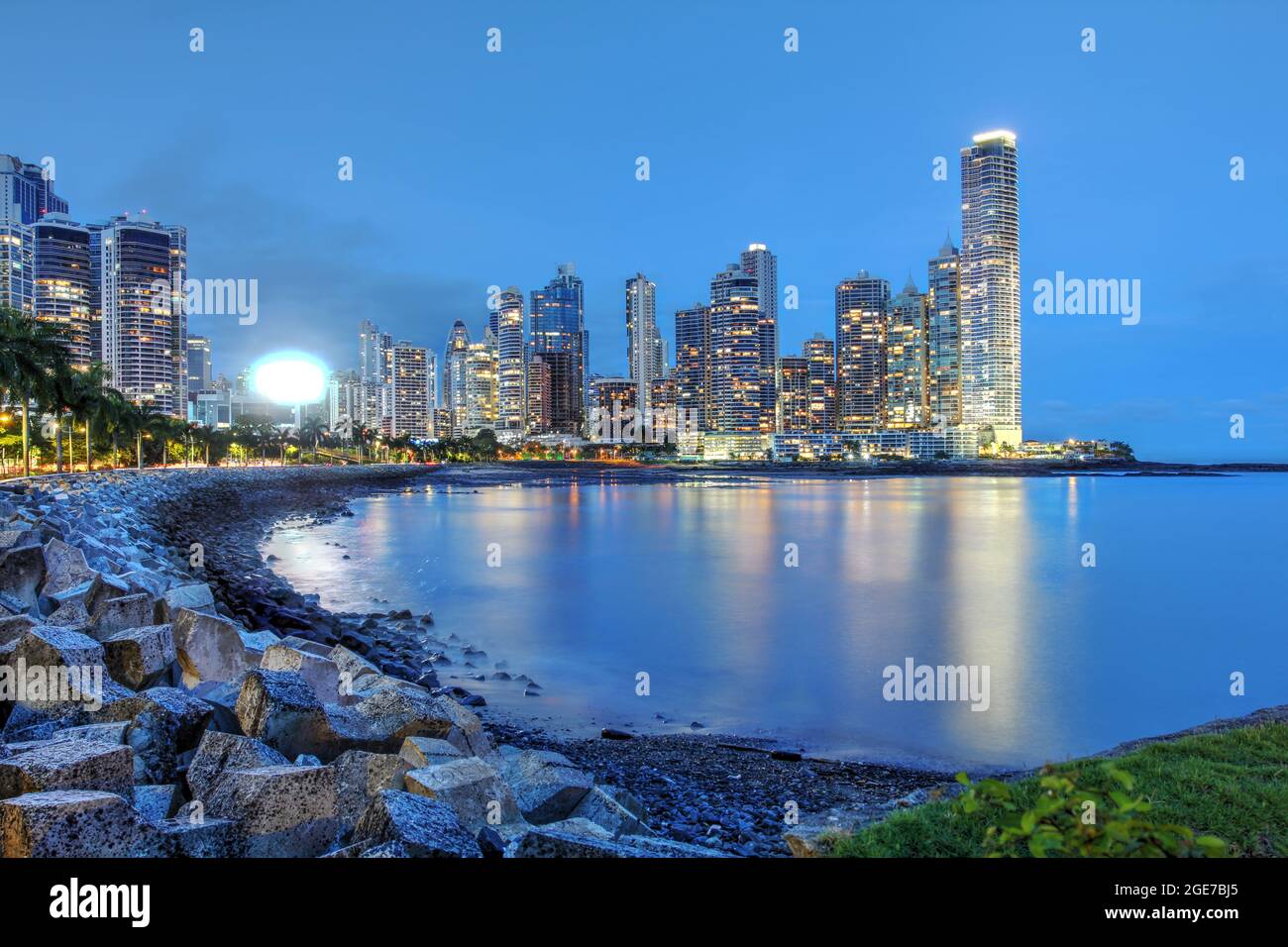 Night scene along the Cinta Costera towards the high-rise part of Panama City - Paitilla district. The beautiful skyline is framed in a little gulf. Stock Photo