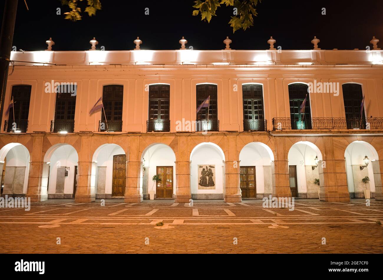 Cordoba, Argentina - January, 2020: Part of city hall of Cordoba building called Cabildo de Cordoba at night with lighting and Argentinian flags Stock Photo