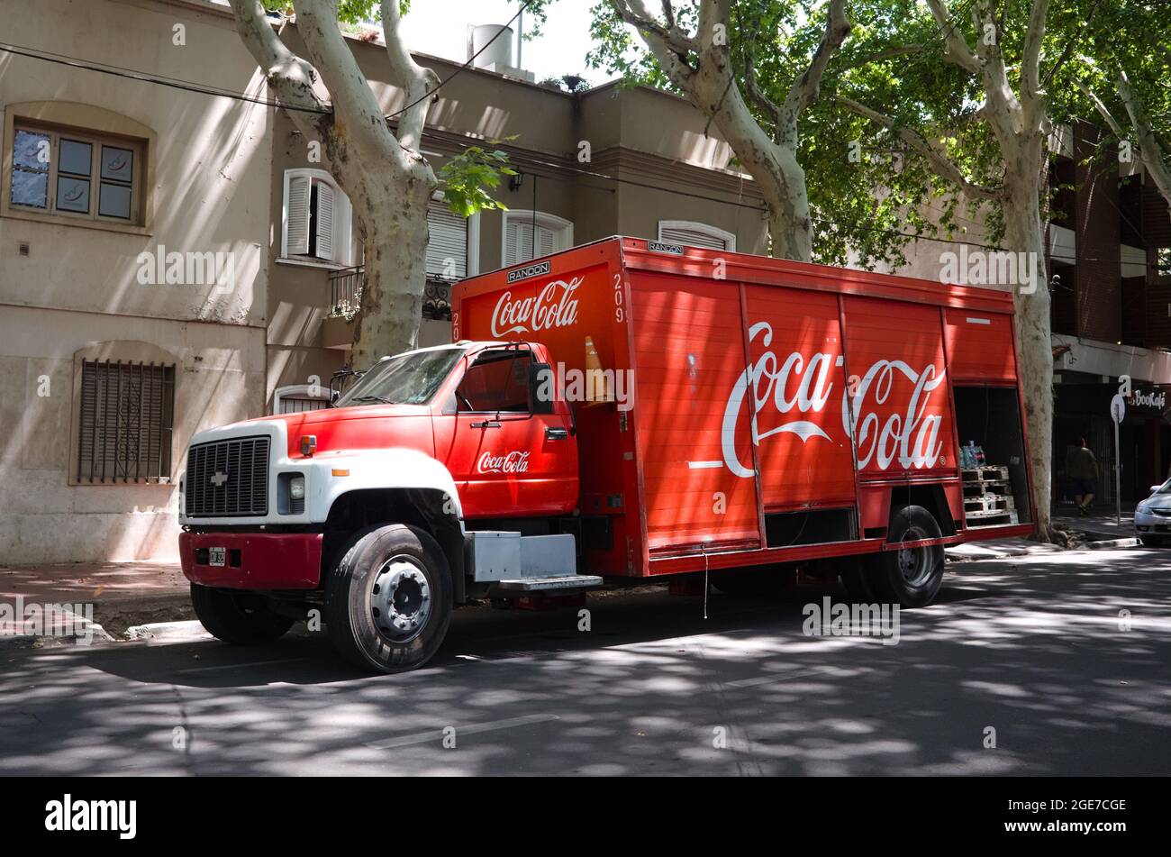 Mendoza, Argentina - January, 2020: Old red Chevrolet  truck with Coca-Cola brand inscription is delivery goods on. Vintage truck in red colour Stock Photo