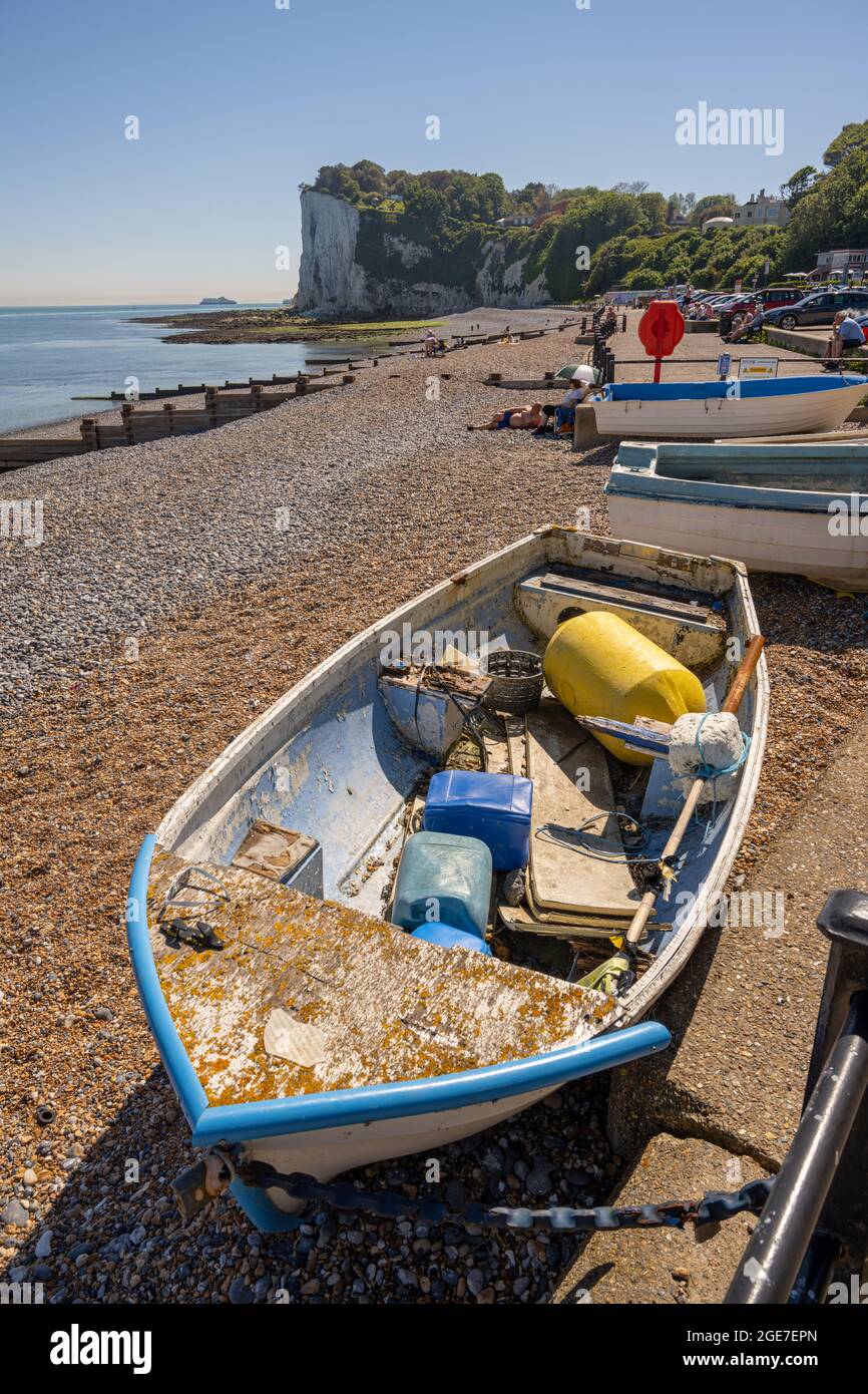 Smalll boat pulled up on the beach at St Margaret’s bay Kent Stock