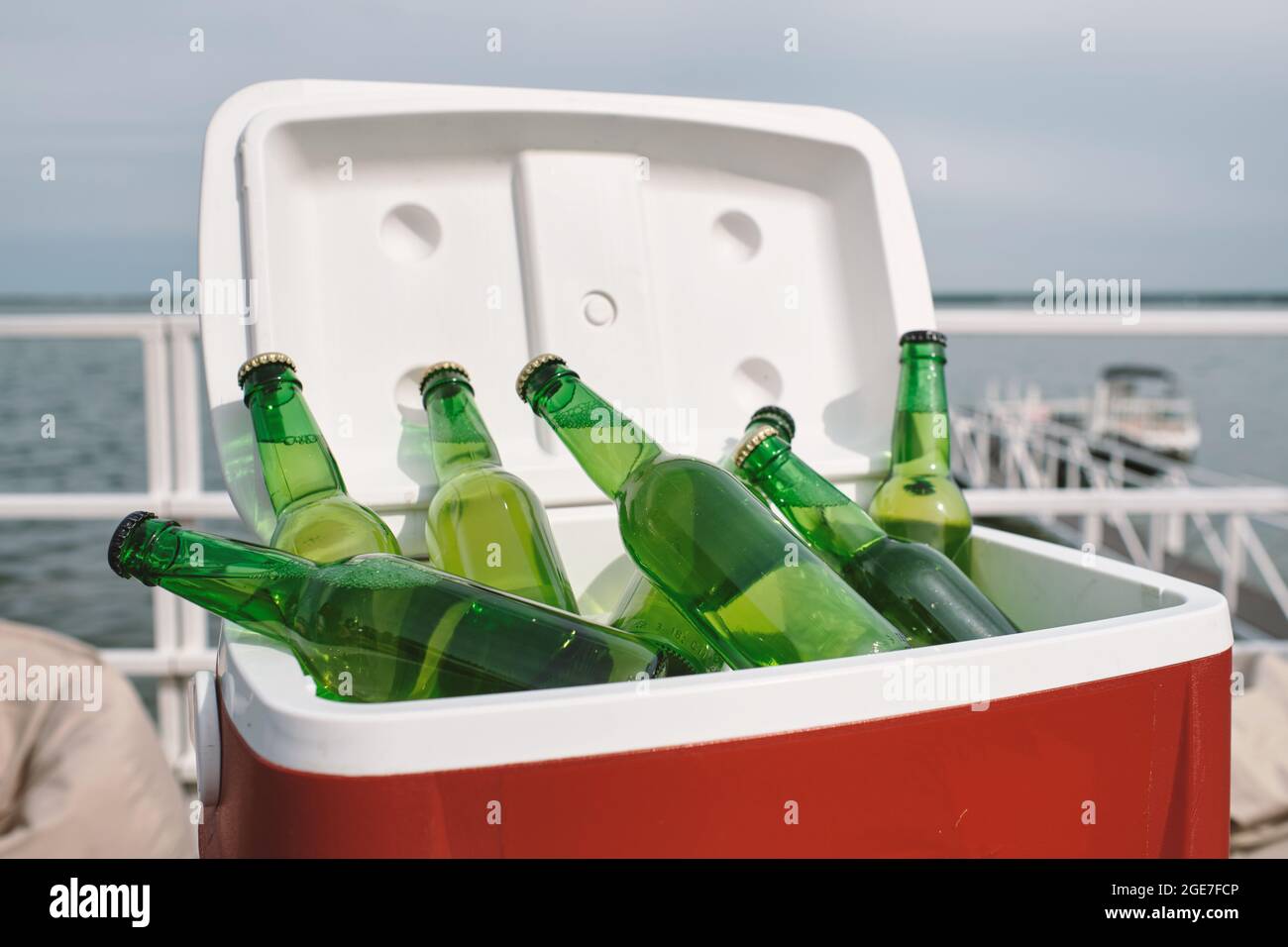Cooler box with glass of refreshing drinks or beer prepared for birthday party Stock Photo
