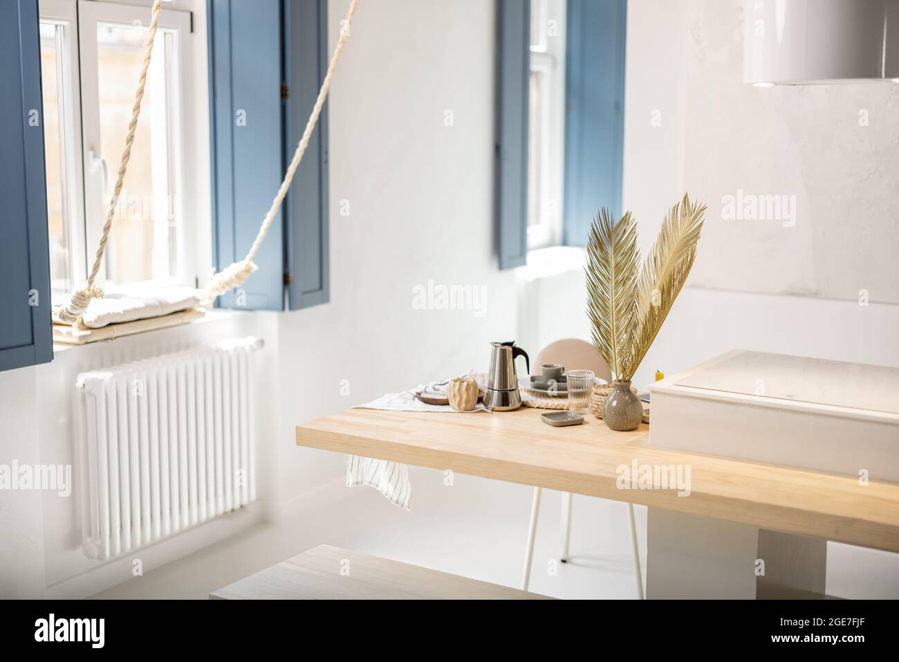 Served table for breakfast in a modern apartment Stock Photo