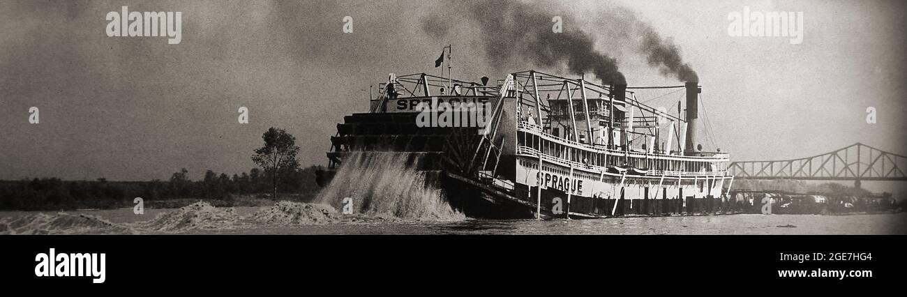 The giant American paddle steamer SPRAGUE near Baton Rouge Bridge in 1947. It  was built at Dubuque, Iowa Iron Works in 1901 by Captain Peter Sprague for the Monongahela River Consolidated Coal and Coke Company, Known as Big Mama she was the world's largest steam powered sternwheeler towboat. The vessel was destroyed by fire at  in Vicksburg on 15 April 1974. Stock Photo