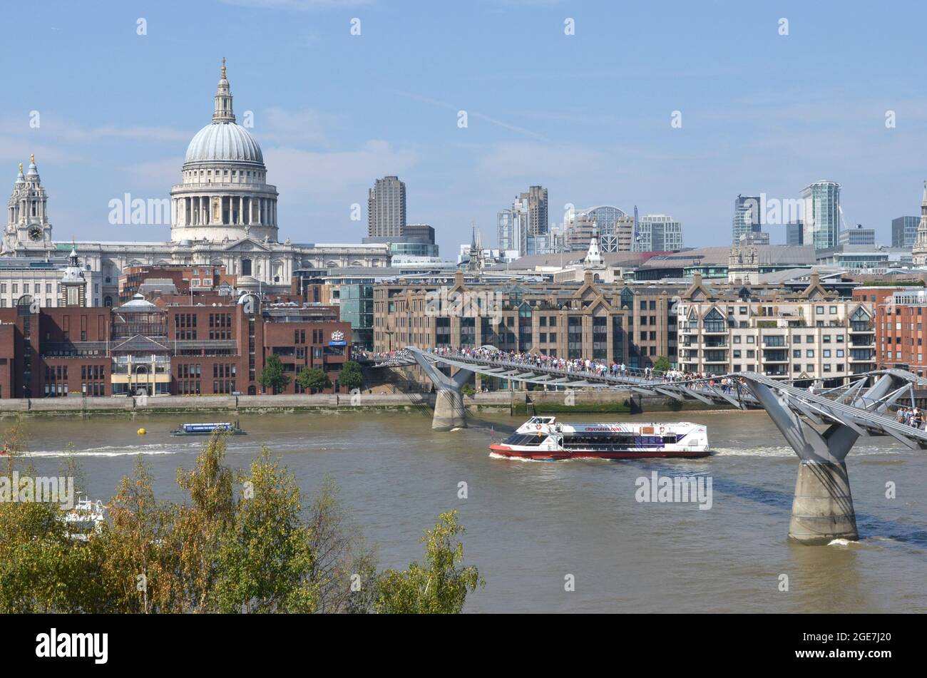 LONDON, UNITED KINGDOM - Jul 25, 2021: An aerial view of the Millenium bridge and St.Pauls on River Thames, London Stock Photo
