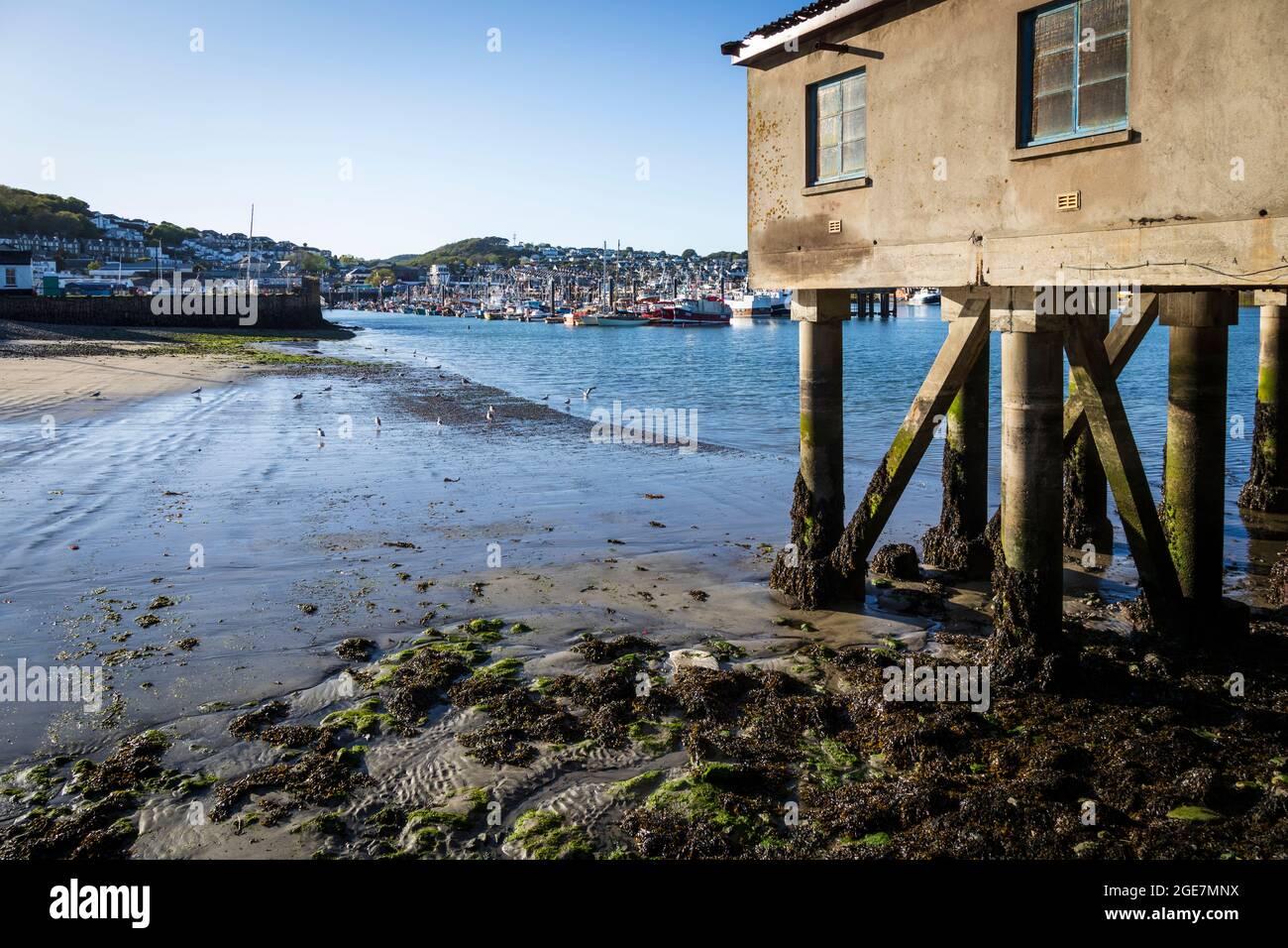 Pillars of the dry dock with Newlyn Harbour in the background, Cornwall, England. Stock Photo