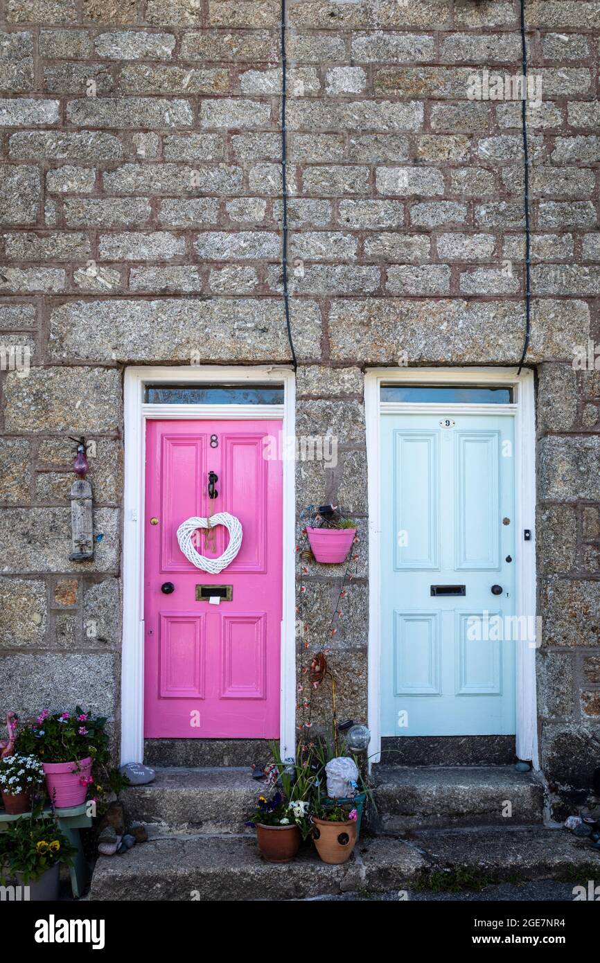 Colourful front doors of stone built cottages in Mousehole, Cornwall, England. Stock Photo