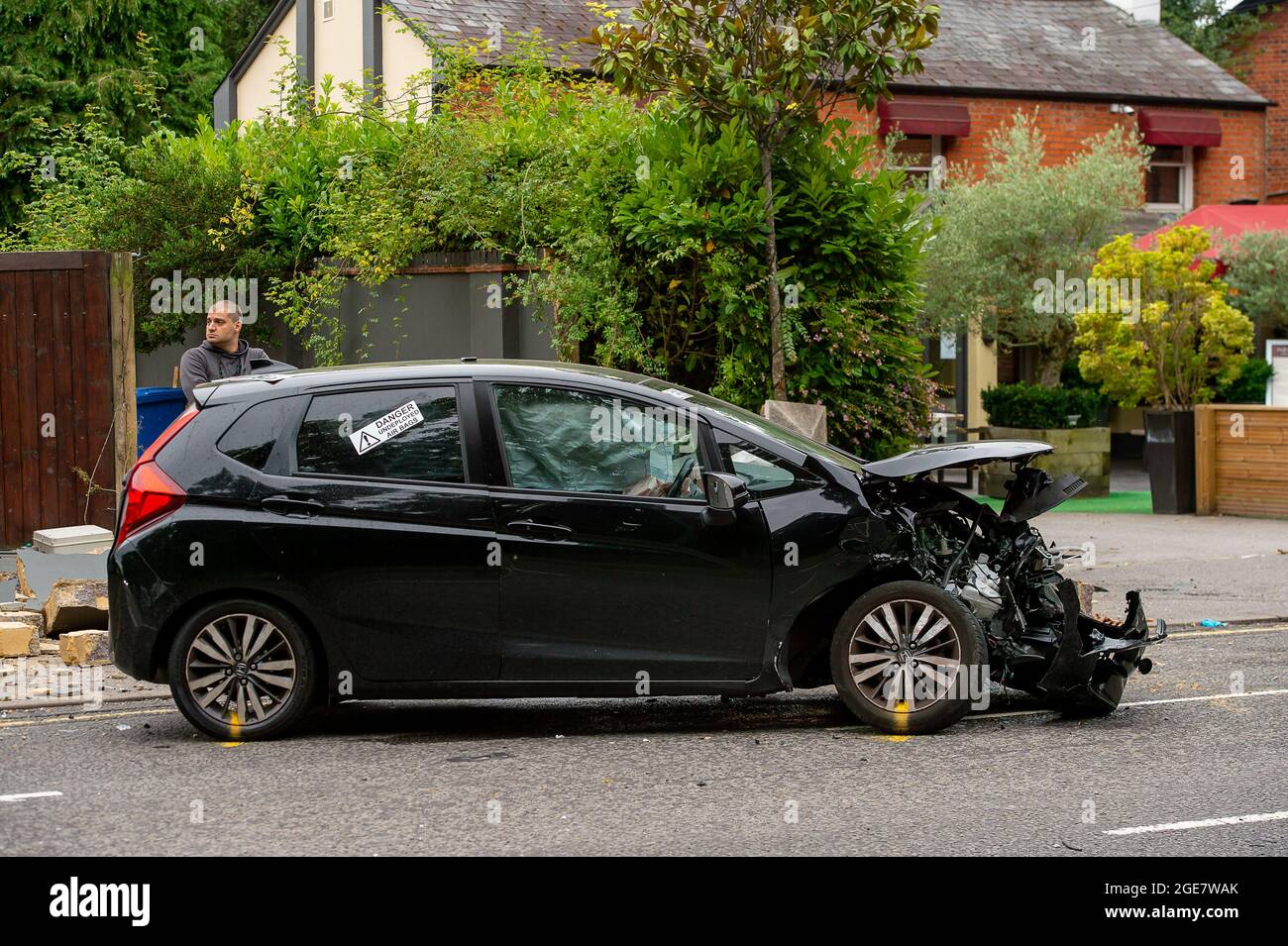 Sunninghill, Berkshire, UK. 17th August, 2021. Part of the A329 was closed this afternoon following a road traffic accident. The RTA occurred near the notorious dangerous T junction on the B383 at Buckhurst Road and the A329. Two cars were badly damaged and the wall of a residential property on the A329 was knocked down. An ambulance was in attendance at the scene of the accident. Credit: Maureen McLean/Alamy Live News Stock Photo