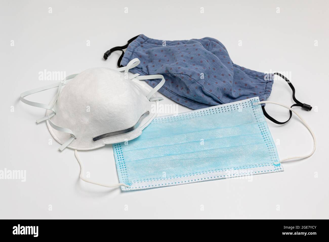 N95, surgical and cloth face masks. Covid-19 face mask choices, comparison and protection concept Stock Photo