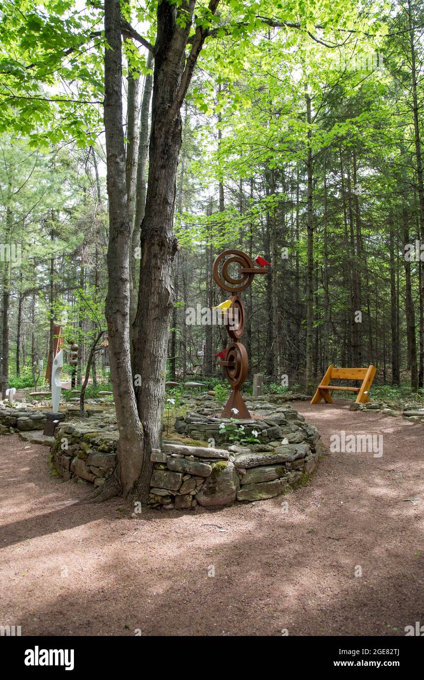 Sculptures fill the grounds and the forest at Edgewood Orchard Galleries Stock Photo
