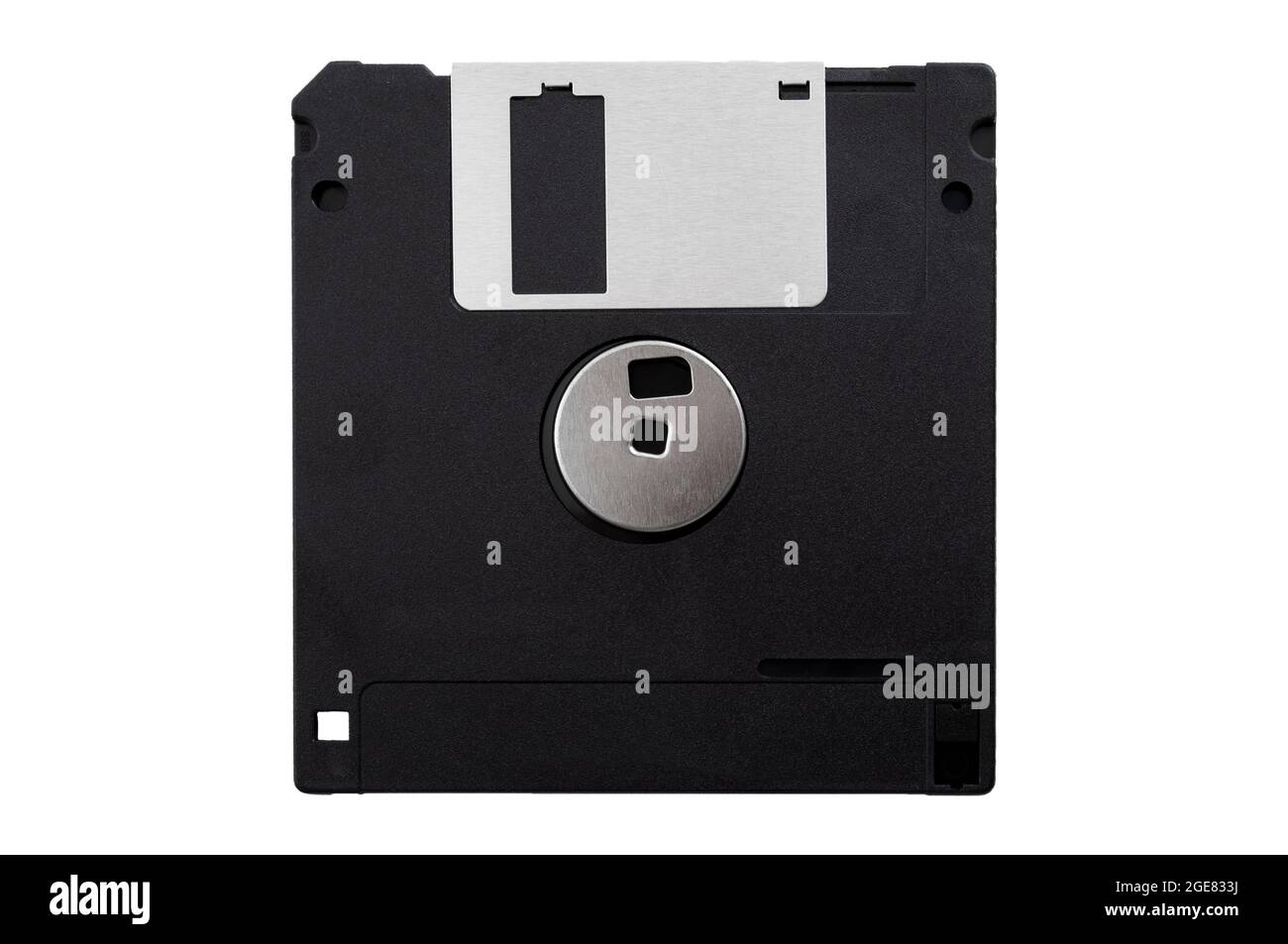 Obsolete data storage technology, retro digital medium and nostalgia concept with a tilted floppy disk isolated on white background facing the back si Stock Photo