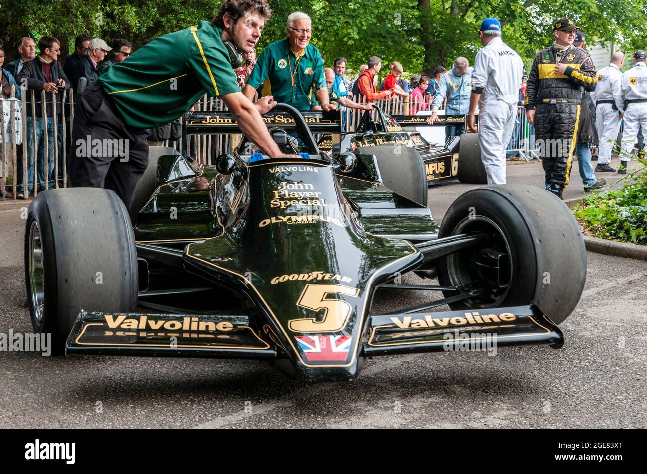 Classic Lotus 79 Formula 1, Grand Prix racing car at the Goodwood Festival of Speed motor racing event 2014. Classic Team Lotus crew pushing car Stock Photo