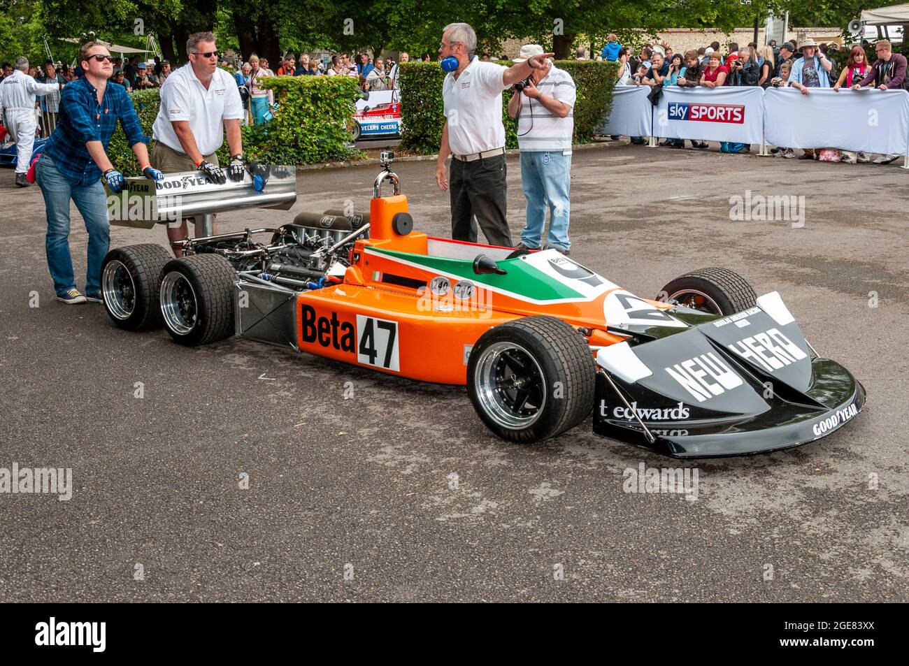 March 2-4-0 experimental six-wheeled Formula One racing car built by March Engineering at the Goodwood Festival of Speed motor racing event. Pushing Stock Photo