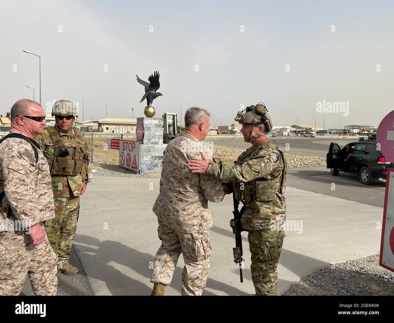 Kabul, Afghanistan. 17th Aug, 2021. U.S. Marine Corps Gen. Frank McKenzie, left, the commander of U.S. Central Command, greets Navy Rear Adm. Peter Vasely, commander of U.S. Forces Afghanistan-Forward, at Hamid Karzai International Airport August 17, 2021 in Kabul, Afghanistan. Credit: Planetpix/Alamy Live News Stock Photo
