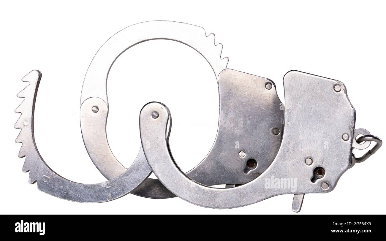 Metal handcuffs to restrain the hands of a criminal. Accessories for policemen working on the street. Isolated background. Stock Photo