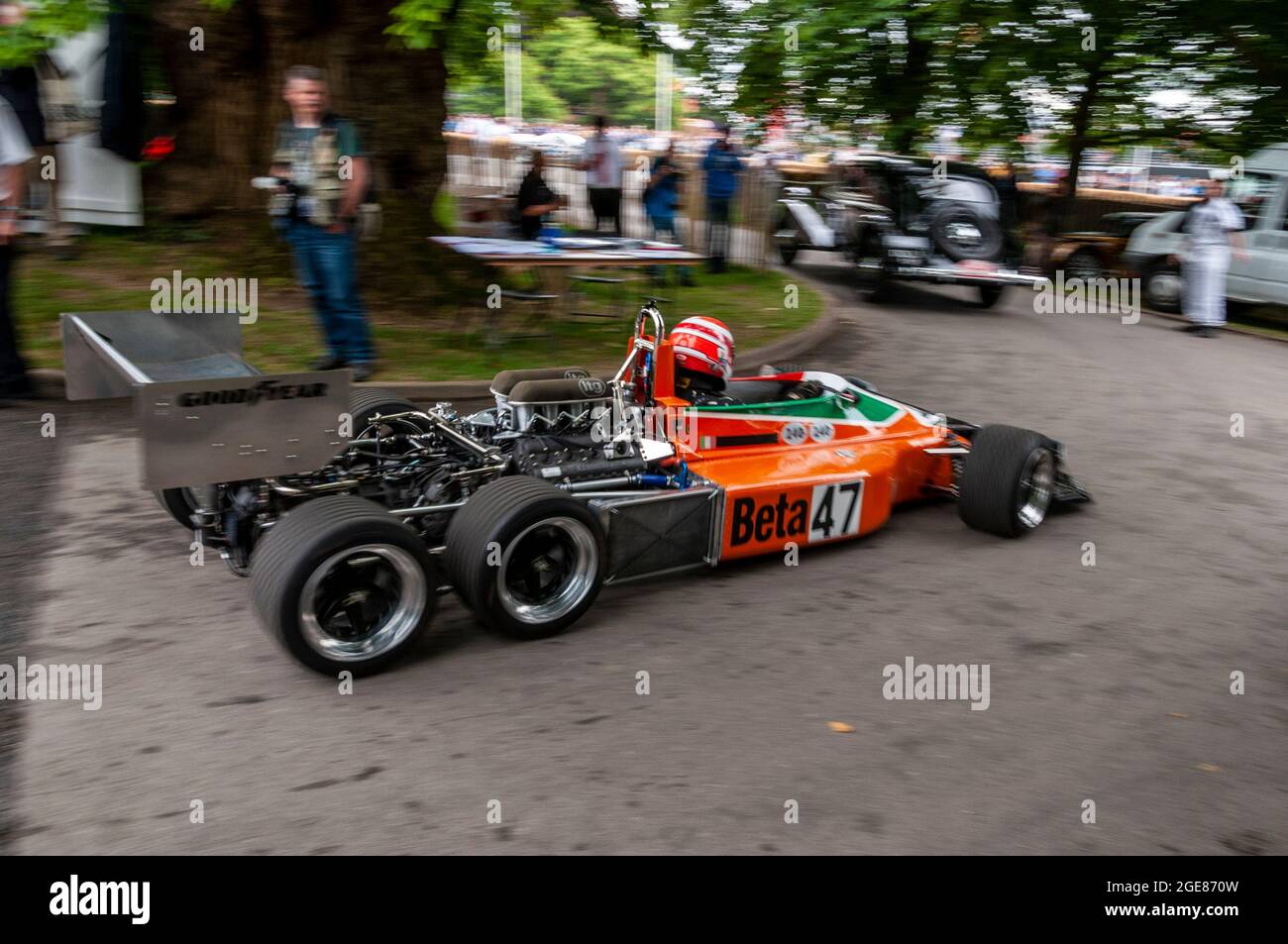 March 2-4-0 experimental six-wheeled Formula One racing car built by March Engineering at the Goodwood Festival of Speed motor racing event. Driving Stock Photo