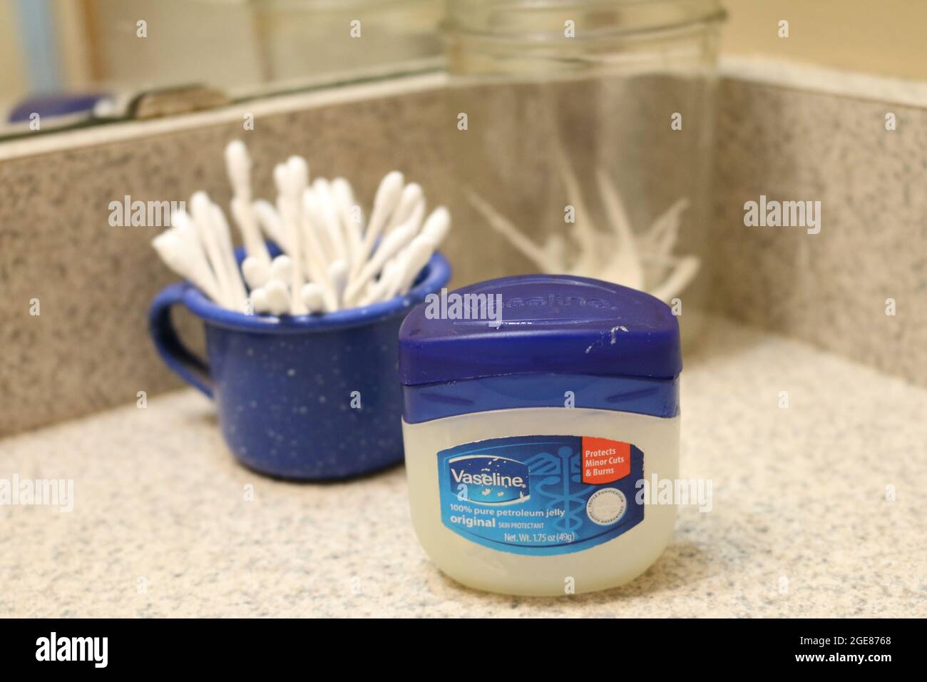 Vaseline, dental floss toothpick, and ear swabs Stock Photo