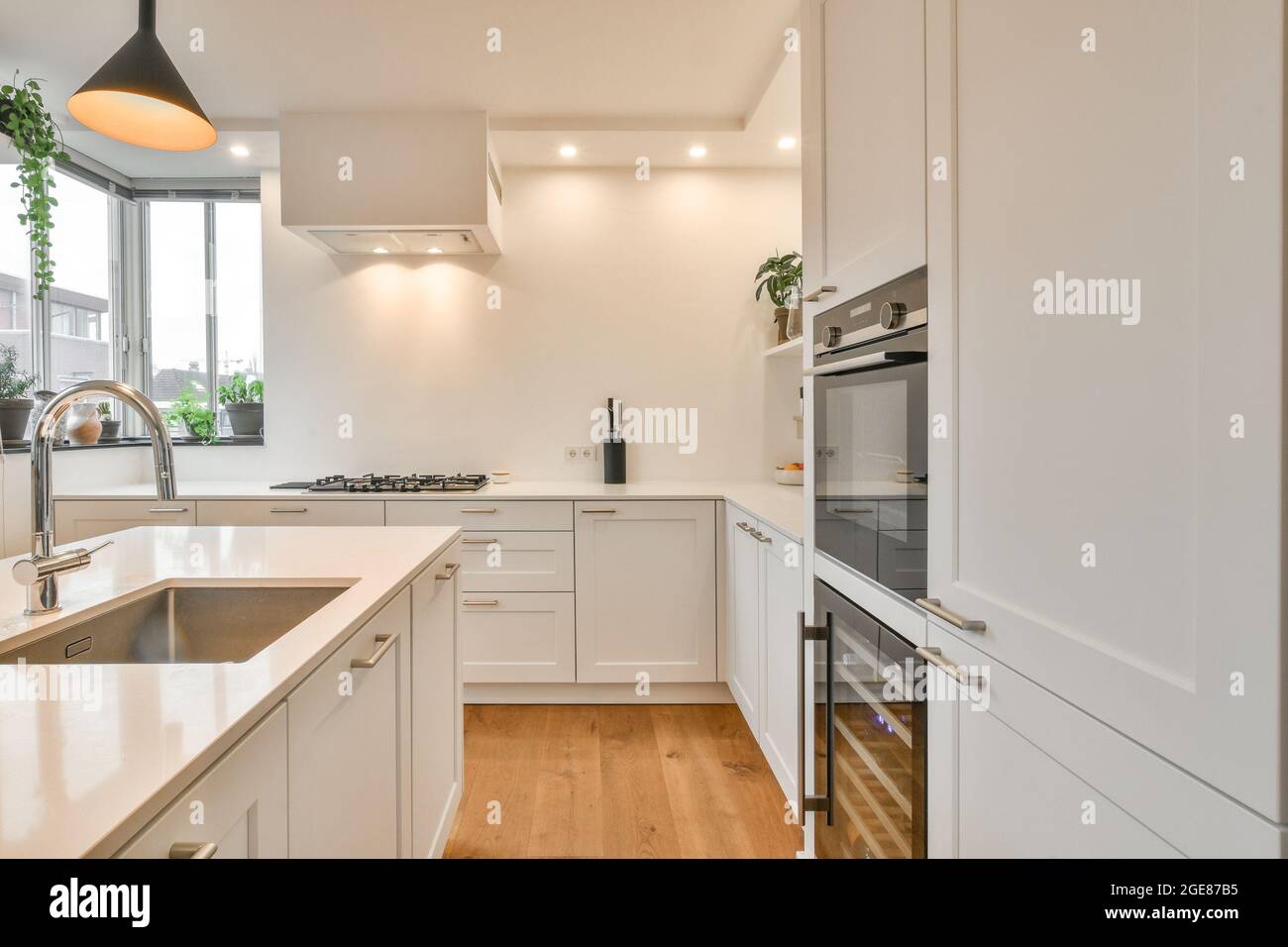 Kitchen of an apartment with modern furniture Stock Photo - Alamy
