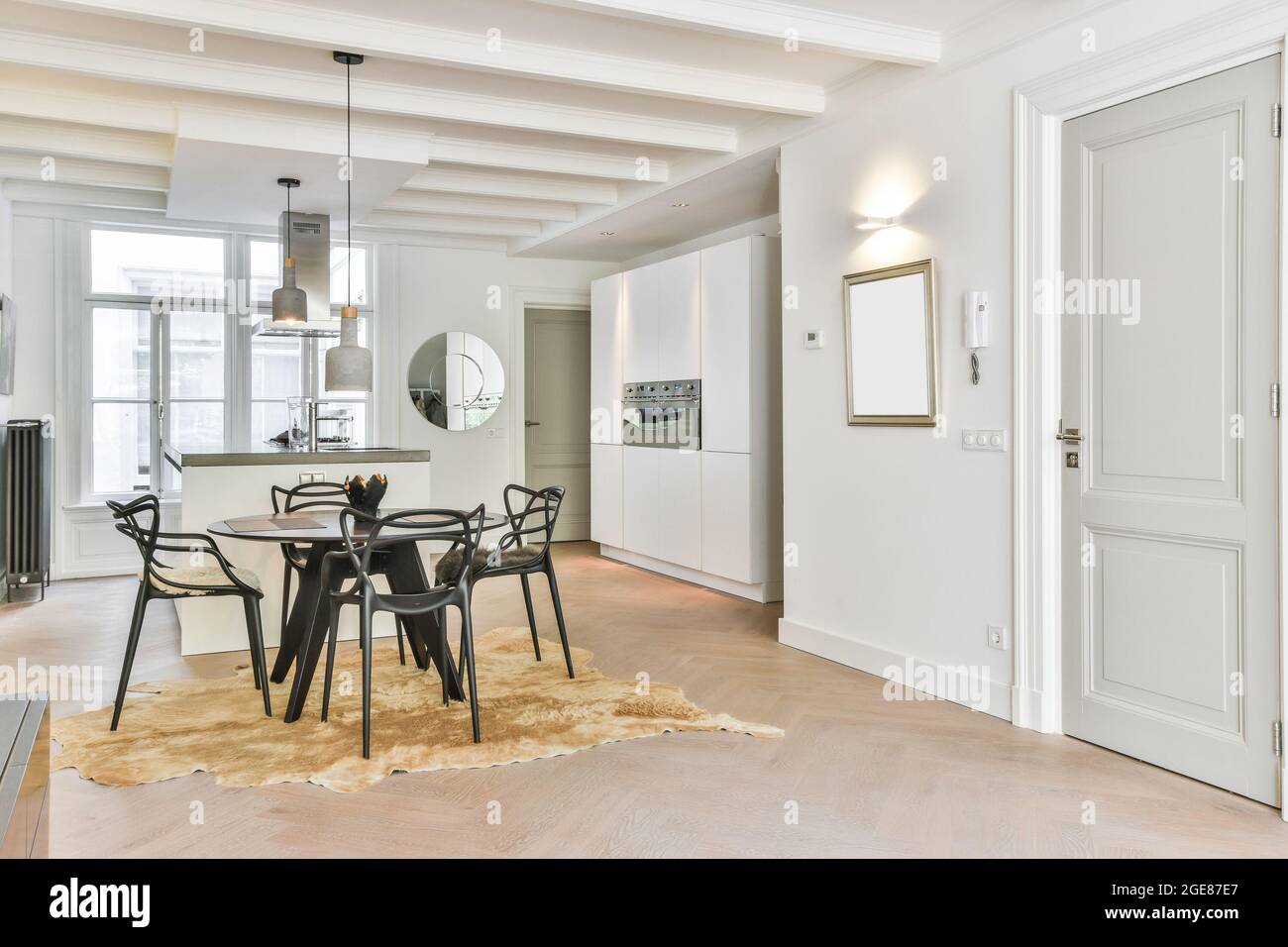 Kitchen and the dining room of a modern apartment Stock Photo - Alamy