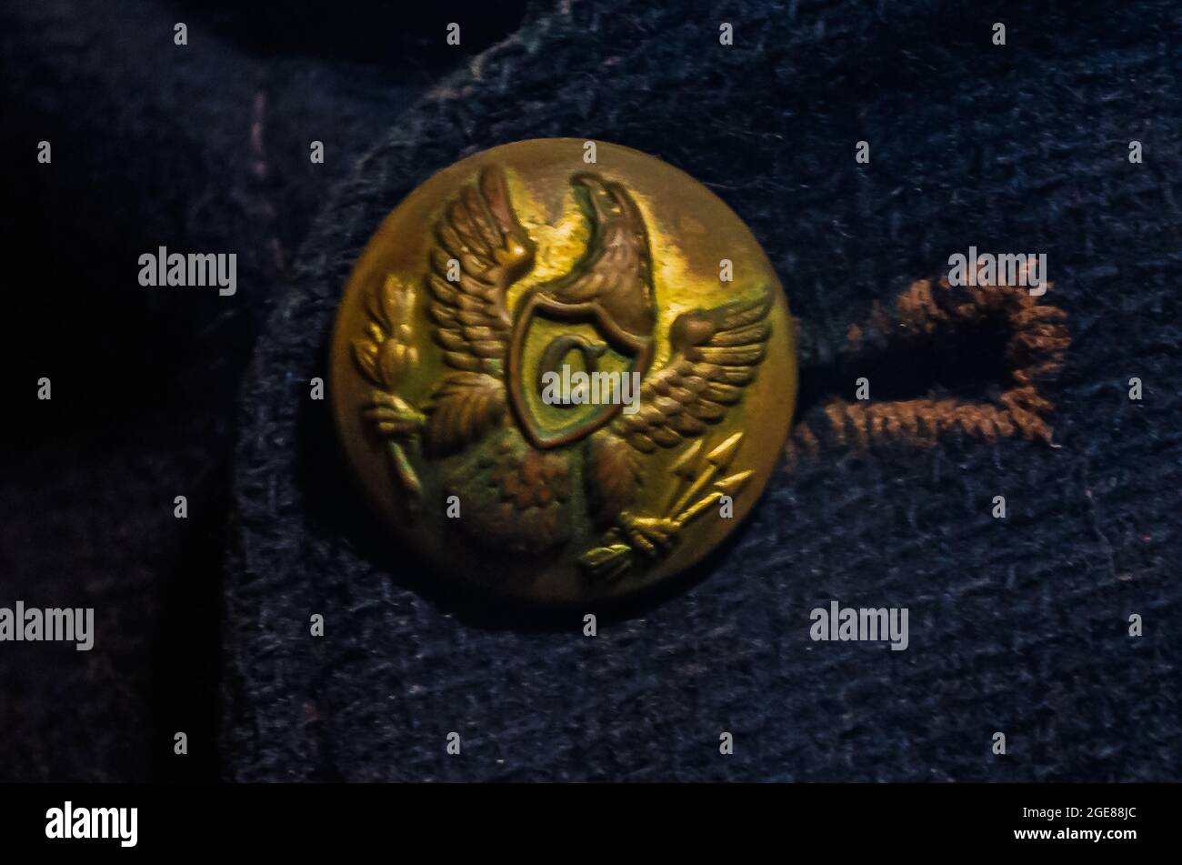 A button on a Federal soldier’s uniform depicts an eagle and a “C” representing the cavalry at the Fort Gaines museum in Dauphin Island, Alabama. Stock Photo