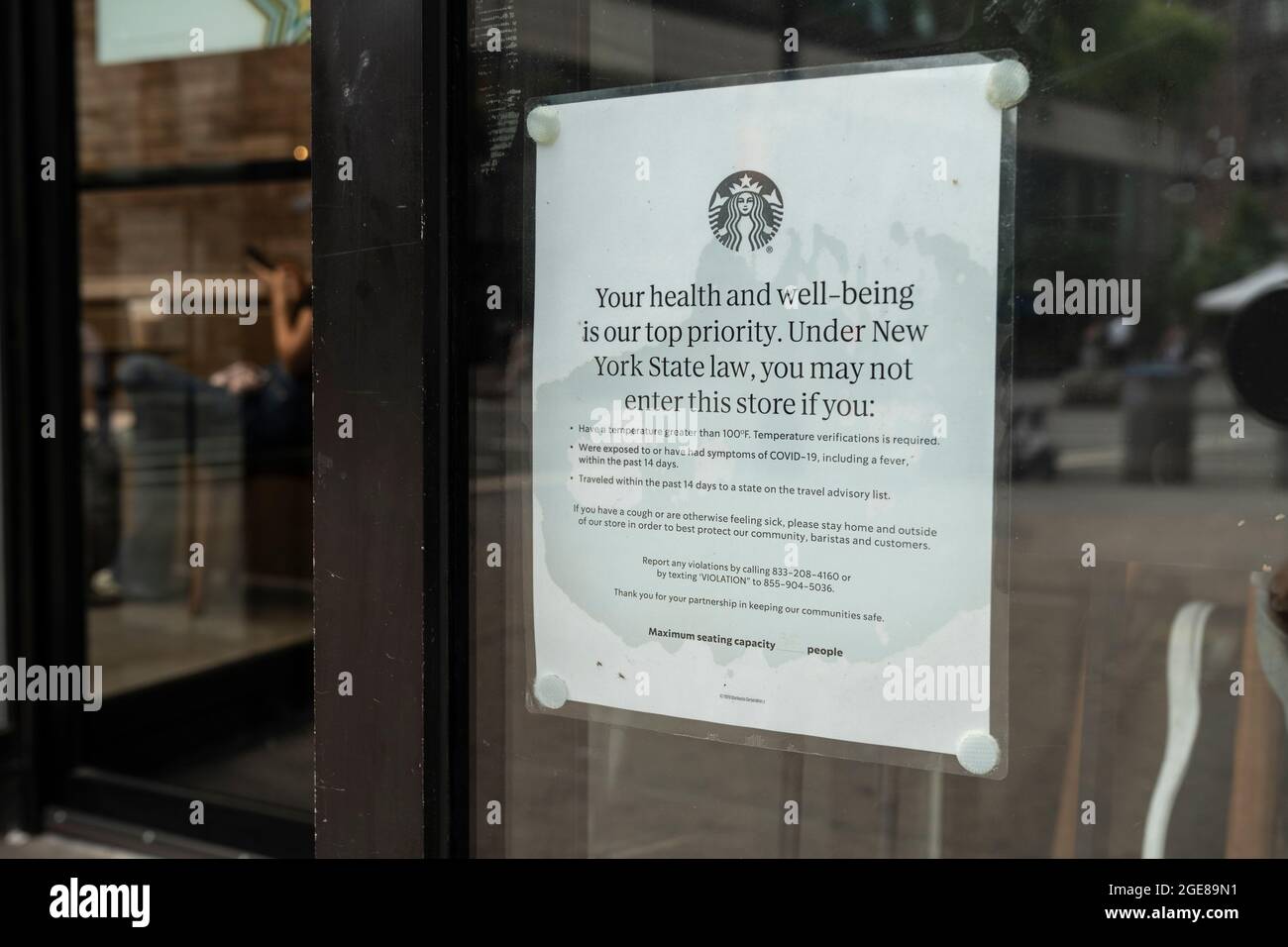New York, NY - August 17, 2021: View of Starbucks cafe on 1st day of vaccine mandate for indoor dining on order by mayor of the city Stock Photo
