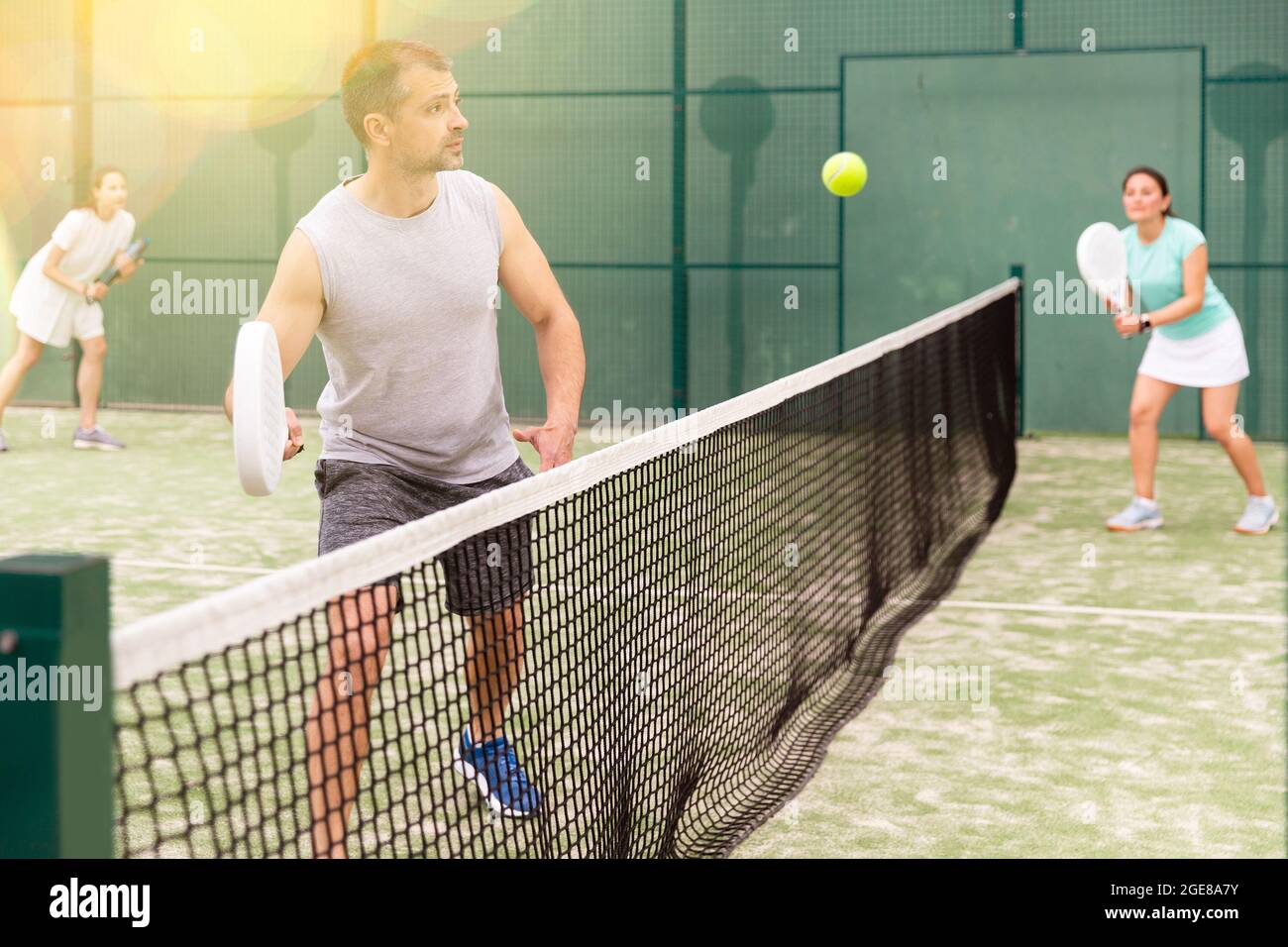 Doubles play in an outdoor paddle game court Stock Photo Alamy