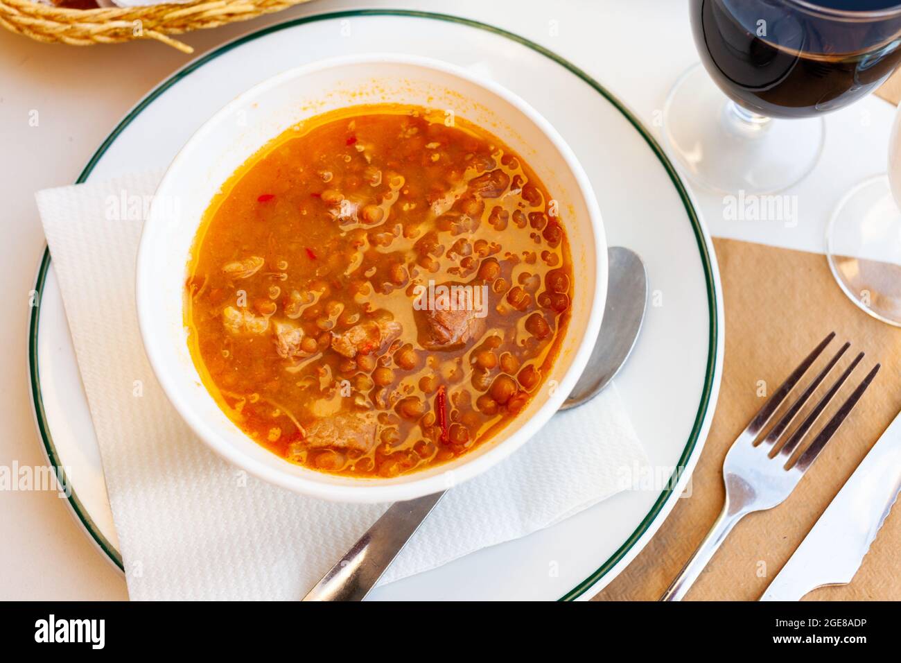Spicy stewed lentils with chorizo, meat and vegetables Stock Photo