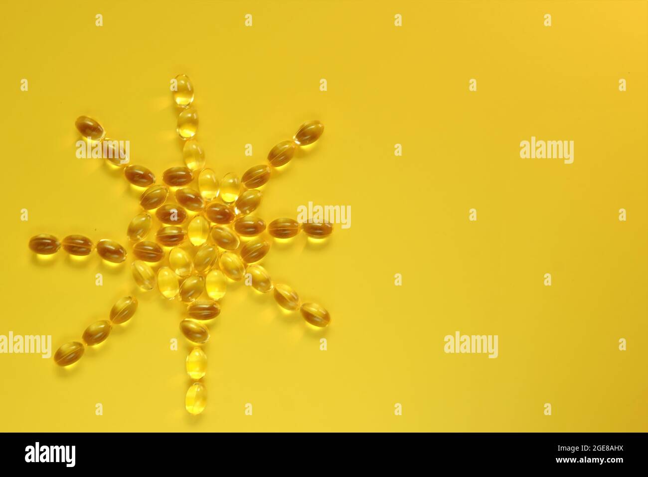Vitamin D.Sun sign made from vitamin D capsules.gelatin capsules with