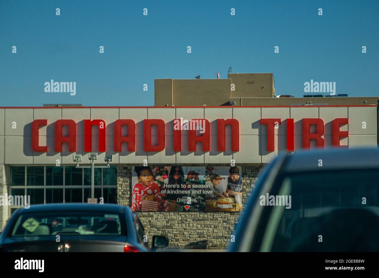 Toronto Canada - Facade of Canadian Tire store facing the parking lot. The store supplies auto parts and household goods for sale to the public. Stock Photo