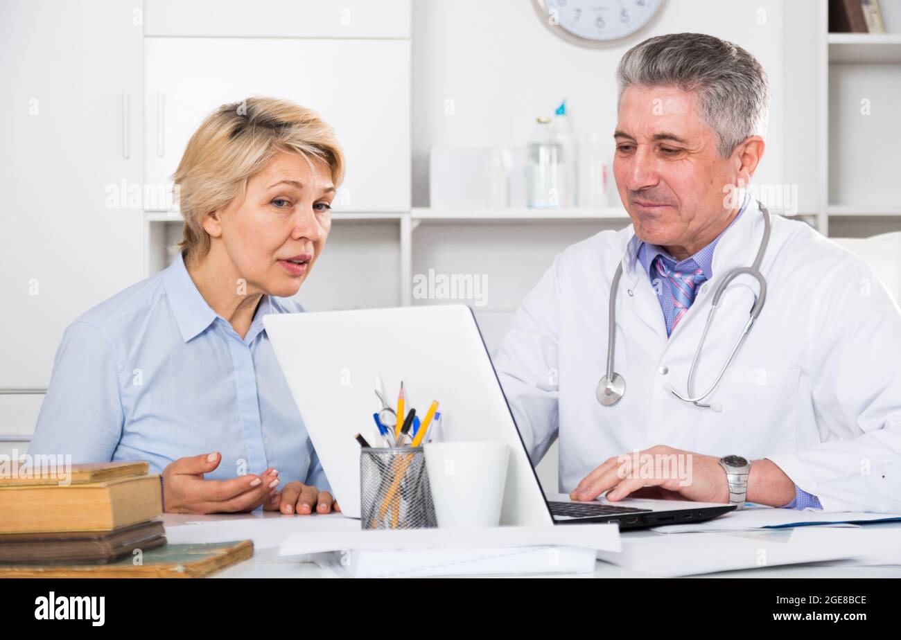 Mature woman visits doctor hi-res stock photography and images - Alamy