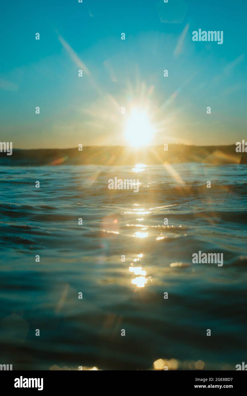 Sun rising over the water at Mollymook Beach. Stock Photo