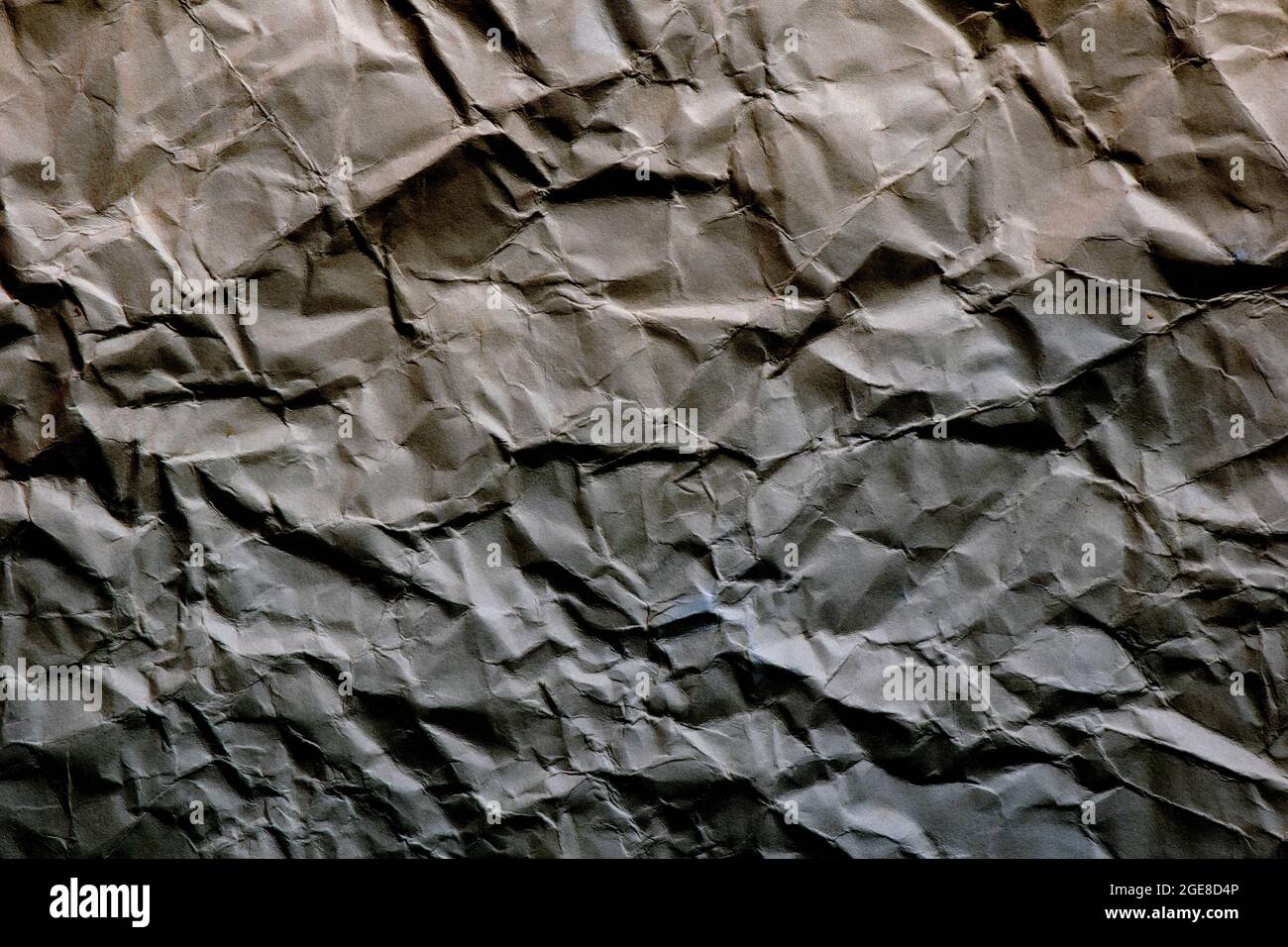 background and texture of brown and grey crumpled paper Stock Photo