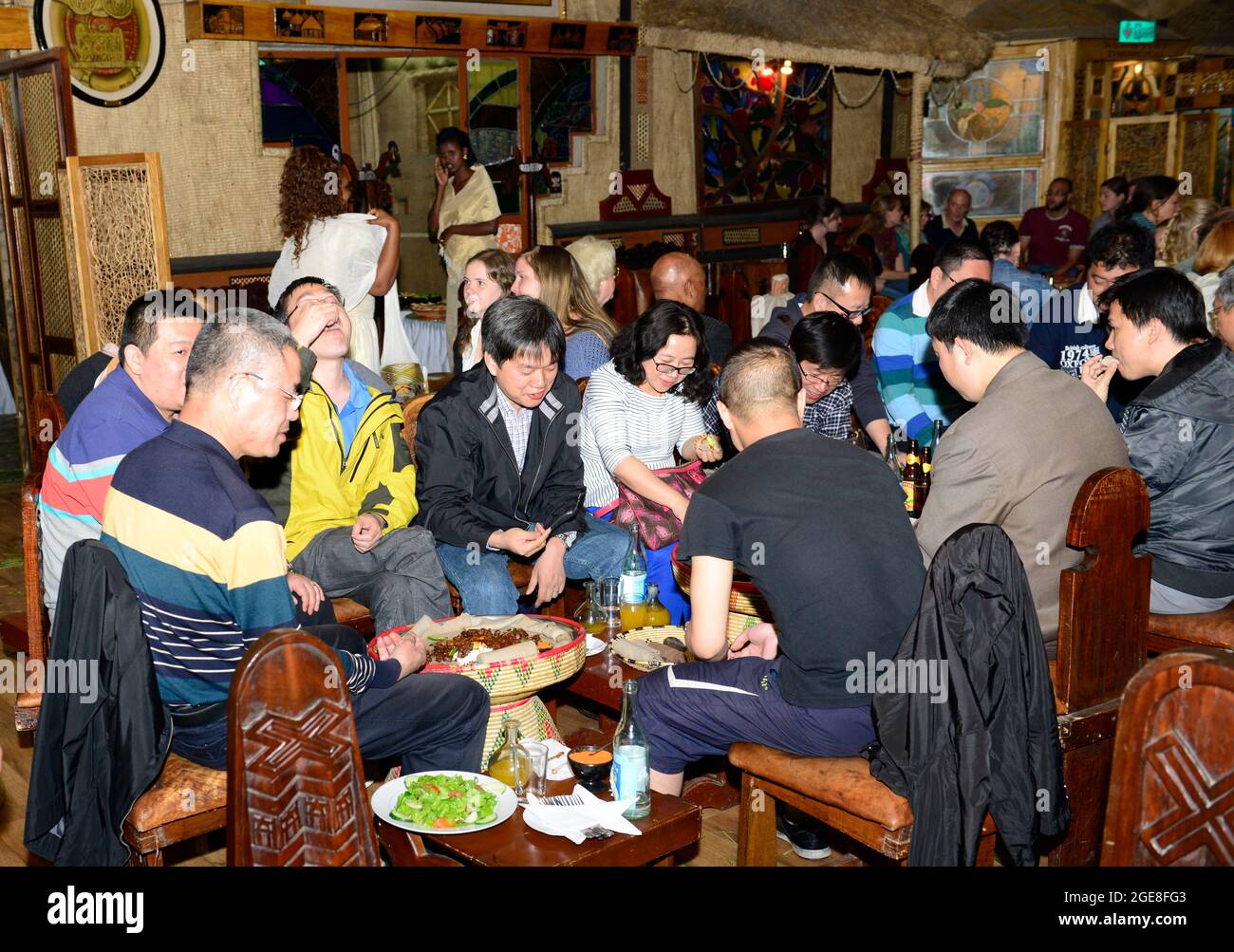 Tourist eating traditional Ethiopian food in the Yod Abyssinia