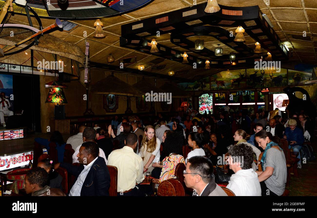Tourist eating traditional Ethiopian food in the Yod Abyssinia