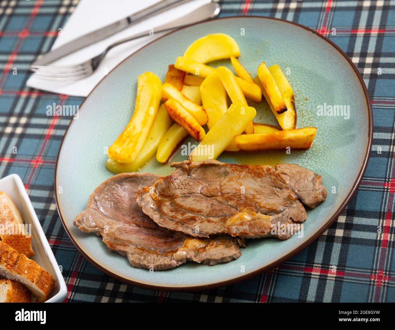 Traditional spanish grilled beef with potato Stock Photo - Alamy